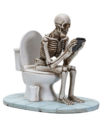 Skelett auf der Toilettenschüssel