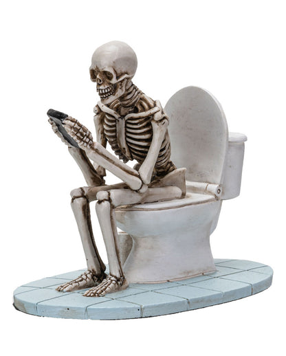 Skelett auf der Toilettenschüssel