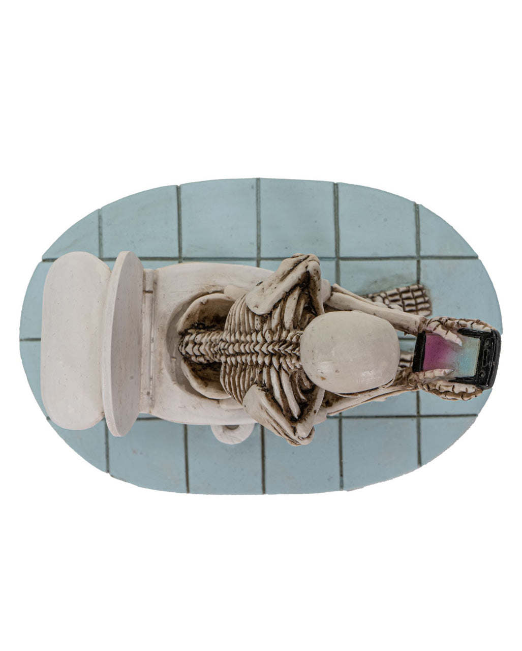 Skelett auf der Toilettenschüssel